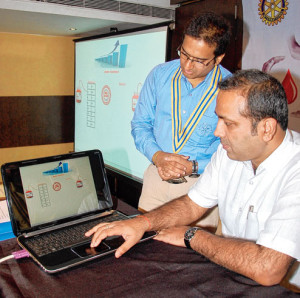 Picture showing Prasant Kumar looking at the computer was courtesy Telegraph and photographer Gautam Dey.